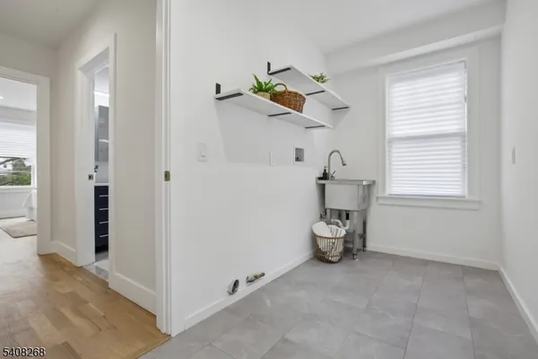 a bedroom with a bed a table and a window