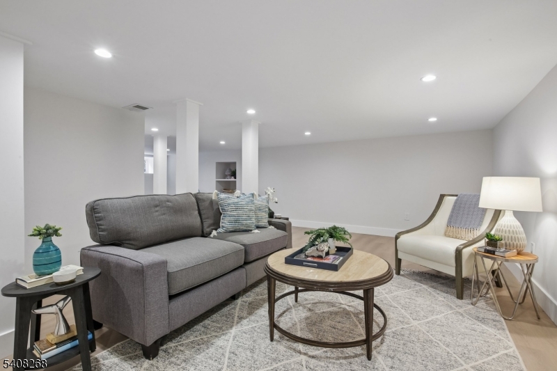 108 Baker Street Maplewood, NJ 07040 - Photo 40 of 46 a living room with furniture and a wooden floor