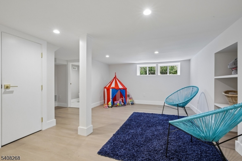 108 Baker Street Maplewood, NJ 07040 - Photo 42 of 46 a living room with furniture and air hockey table