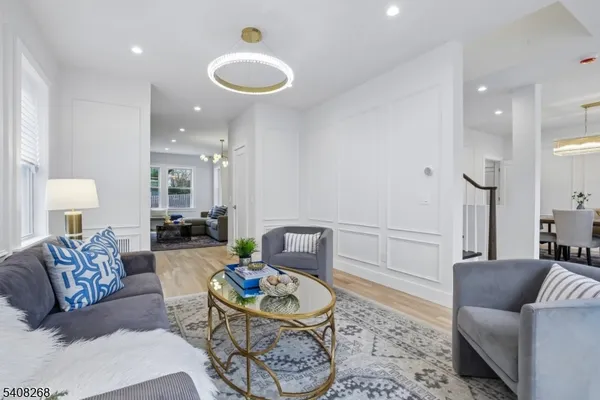 a living room with furniture and a rug