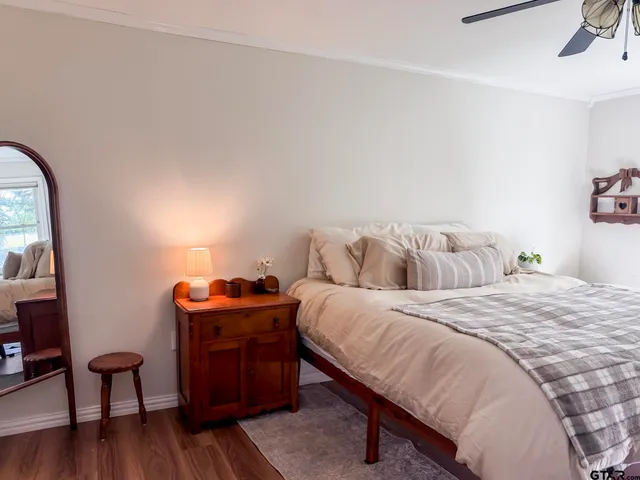 a bedroom with a bed and a table in it