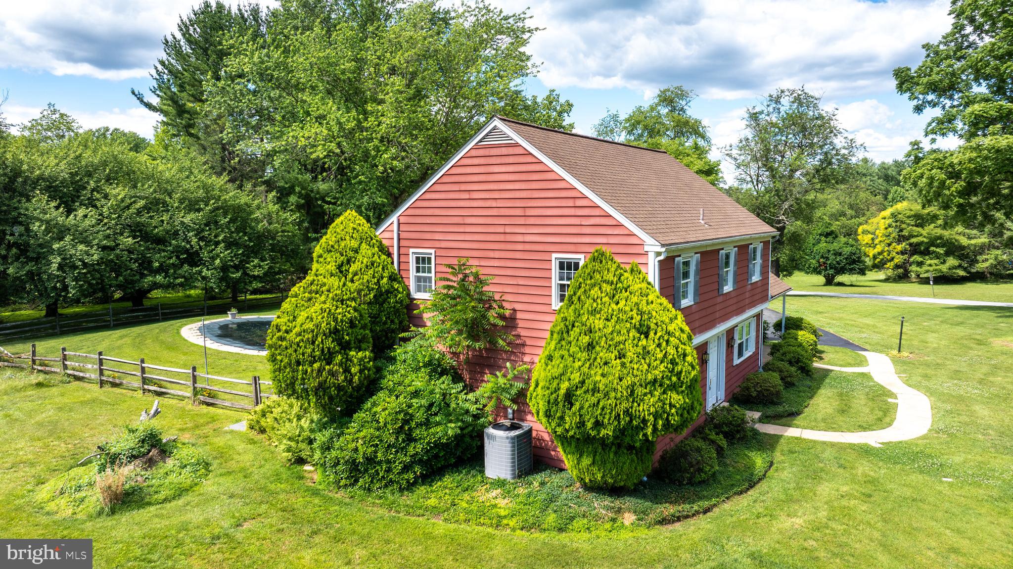 1929 Hillendale Road Chadds Ford, PA 19317 - Photo 4 of 56 a aerial view of a house with swimming pool and garden