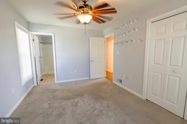a spacious bathroom with a sink toilet and shower
