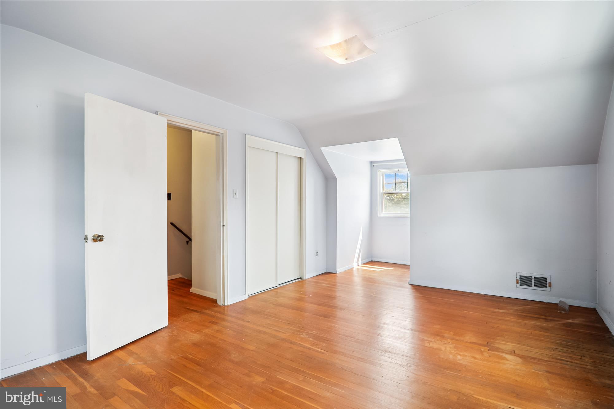 9507 Adelphi Road Silver Spring, MD 20903 - Photo 25 of 41 a view of an empty room with wooden floor