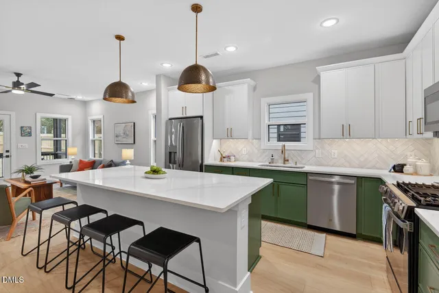 a bathroom with a sink and potted plant