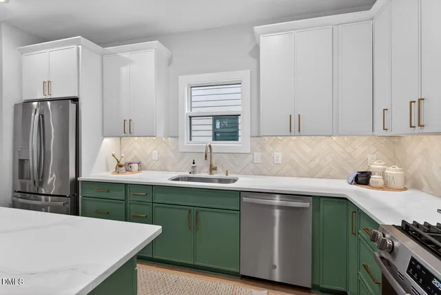 a very nice looking dining room with a large center island and furniture