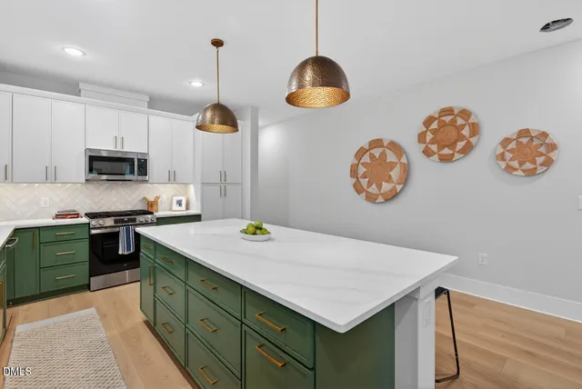 a kitchen with a table and chairs in it