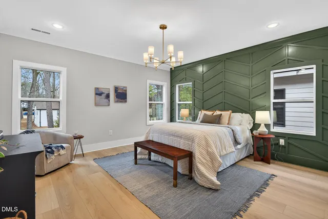 a living room with furniture and kitchen view