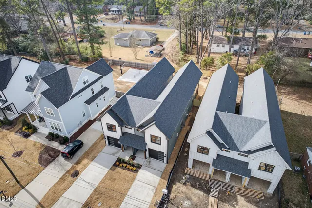 a bathroom with double vanity sink toilet and shower