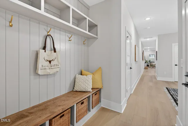 a picture of a bench in front of a wall