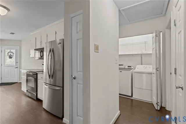 a kitchen with a refrigerator sink and stove
