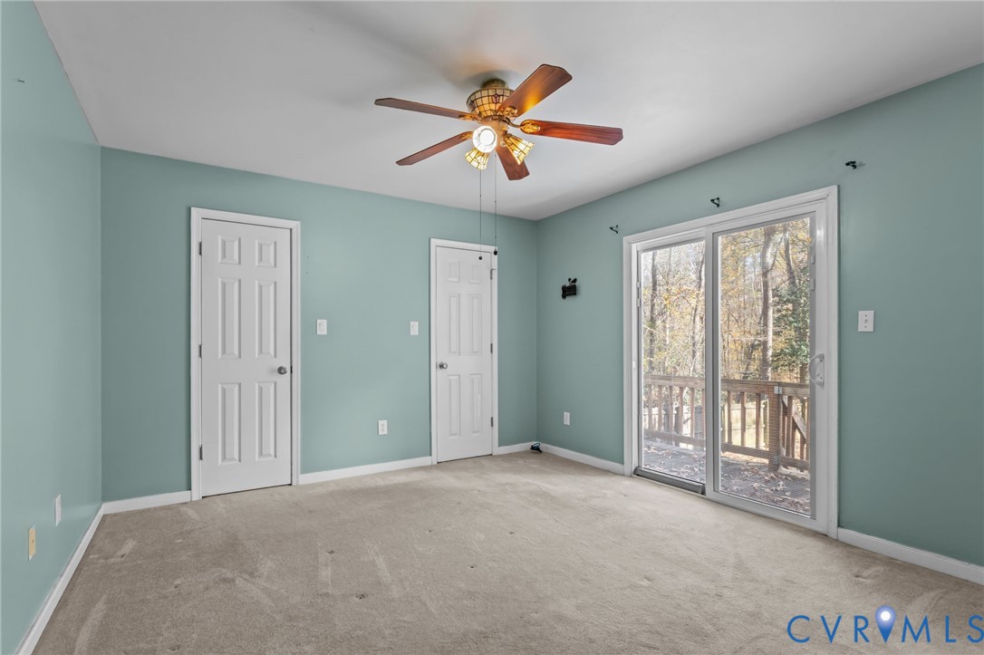 14319 Key Deer Drive Midlothian, VA 23112 - Photo 15 of 42 a view of an empty room with window and a ceiling fan
