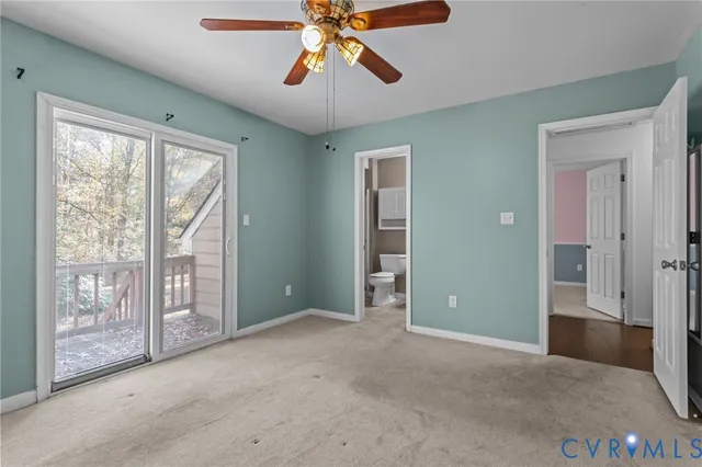 a view of a room with chandelier fan