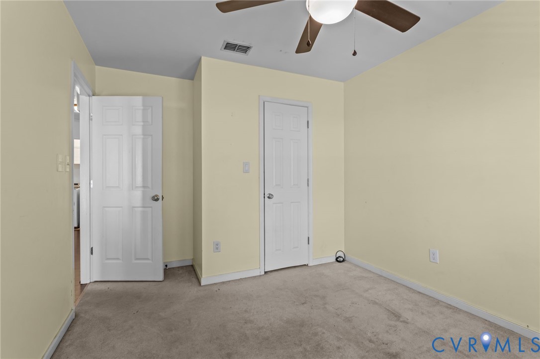 14319 Key Deer Drive Midlothian, VA 23112 - Photo 20 of 42 an empty room with chandelier fan