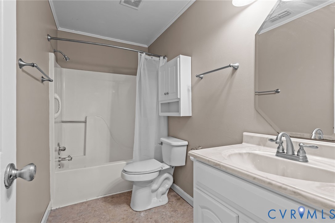 14319 Key Deer Drive Midlothian, VA 23112 - Photo 23 of 42 a bathroom with a sink toilet and shower