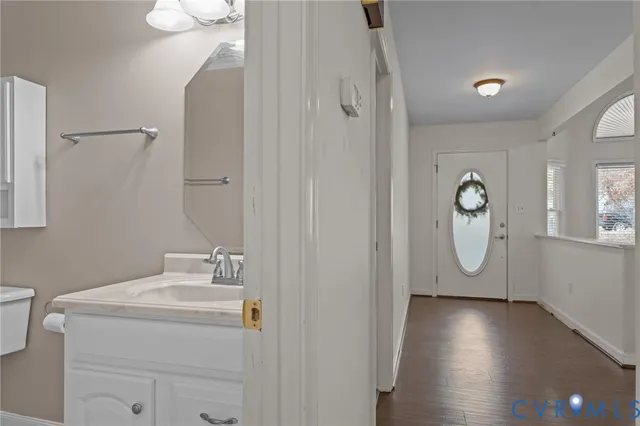 a bathroom with a sink a mirror and shower