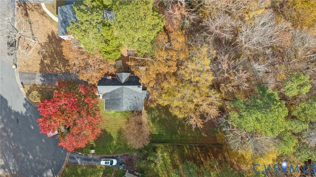 a aerial view of a house with a yard