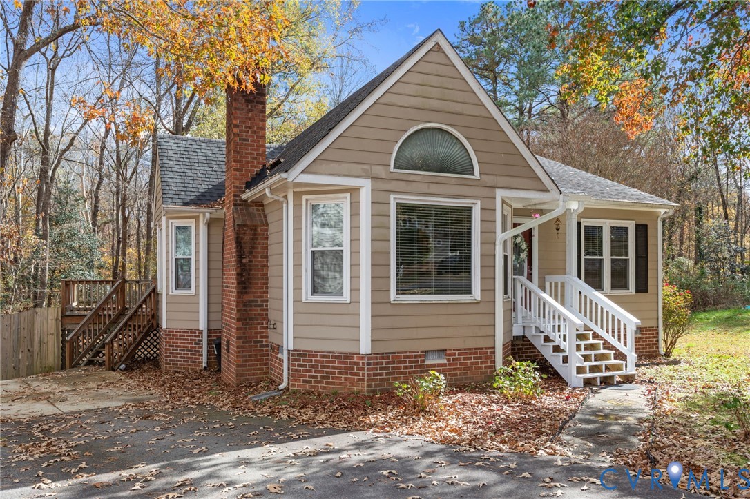 14319 Key Deer Drive Midlothian, VA 23112 - Photo 42 of 42 a front view of a house with garden