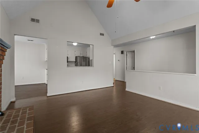 a view of a kitchen with a sink and a refrigerator