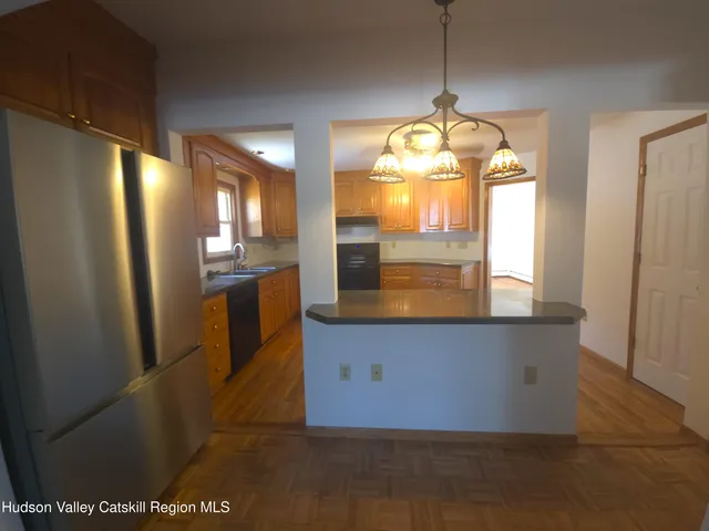 a bedroom with a sink and a mirror