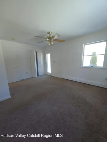a black and white photo of a living room