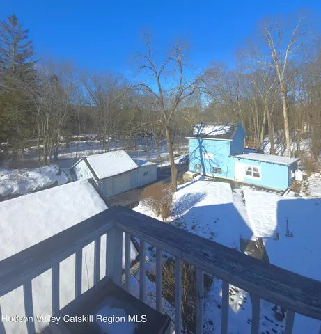 a view of a backyard with large trees
