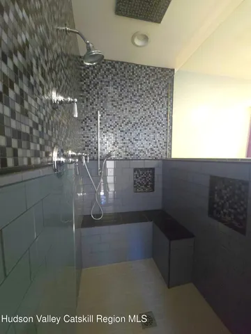 a view of a couches and dinning table and chairs in patio