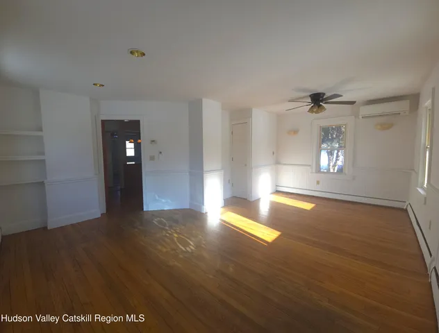 a view of a porch with wooden floor