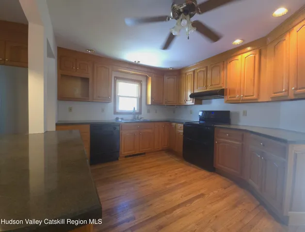 a bathroom with a sink a mirror and a bathtub