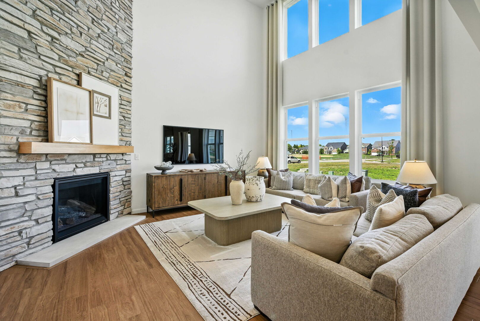 3058 Adler Street New Lenox, IL 60451 - Photo 8 of 17 a living room with furniture a fireplace and a flat screen tv