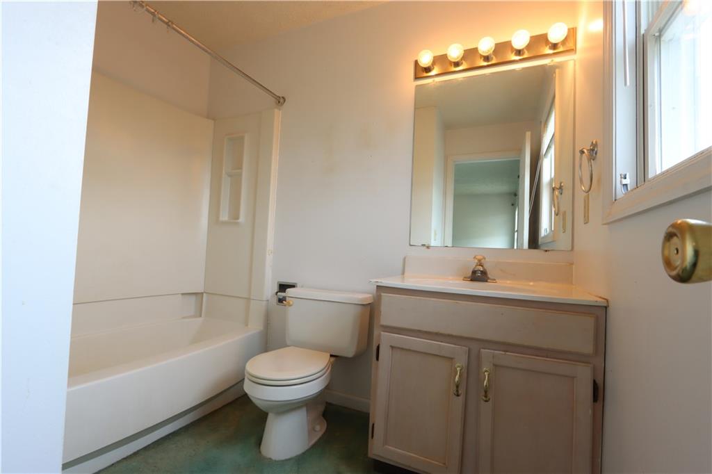370 Pfeifer Road Harmony, PA 16037 - Photo 15 of 35 a bathroom with a toilet a sink a mirror a bathtub and vanity