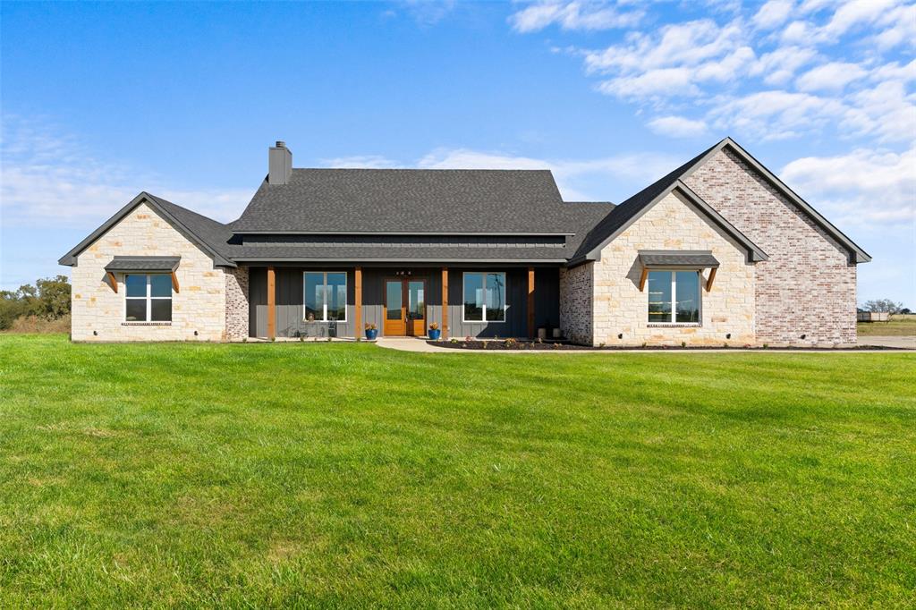 4411 Fm 751 Wills Point Wills Point, TX 75169 - Photo 3 of 40 Expansive front lawn complementing a stone and brick façade home with a dark gray shingle roof