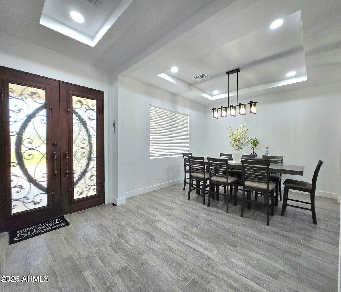 22417 West Lower Buckeye Road Buckeye, AZ 85326 - Photo 14 of 40 Dining area with double entry door