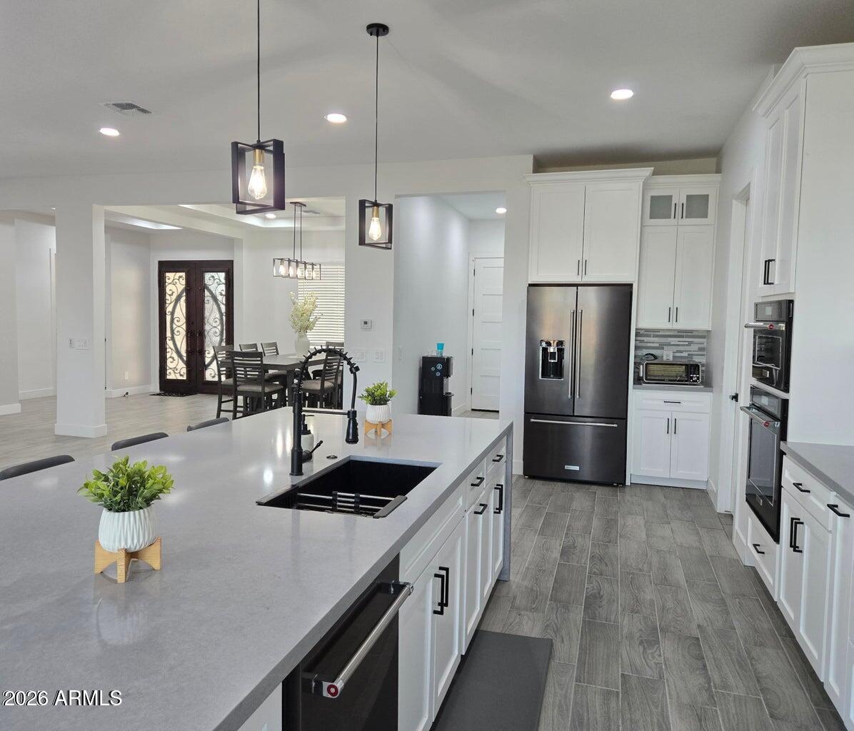 22417 West Lower Buckeye Road Buckeye, AZ 85326 - Photo 8 of 40 kitchen to back door view