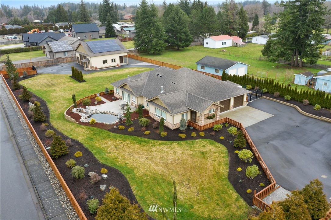 1130 West Axton Road Ferndale, WA 98248 - Photo 1 of 40 an aerial view of a house with a garden and swimming pool