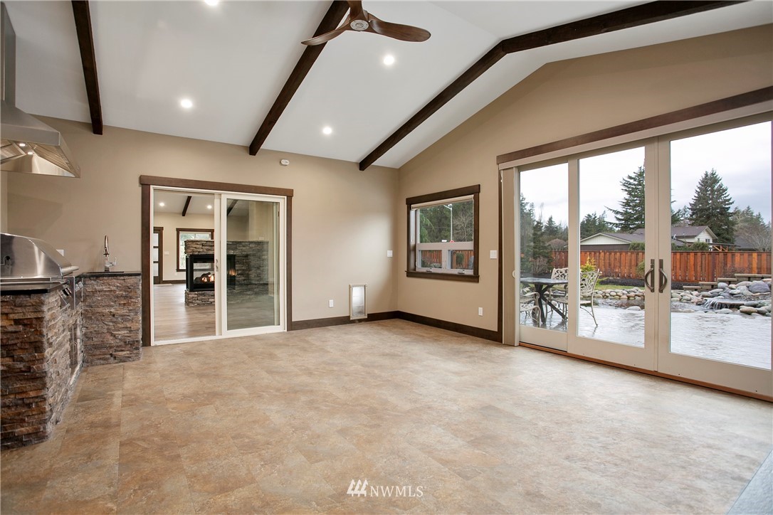 1130 West Axton Road Ferndale, WA 98248 - Photo 13 of 40 a view of a big room with windows and chandelier