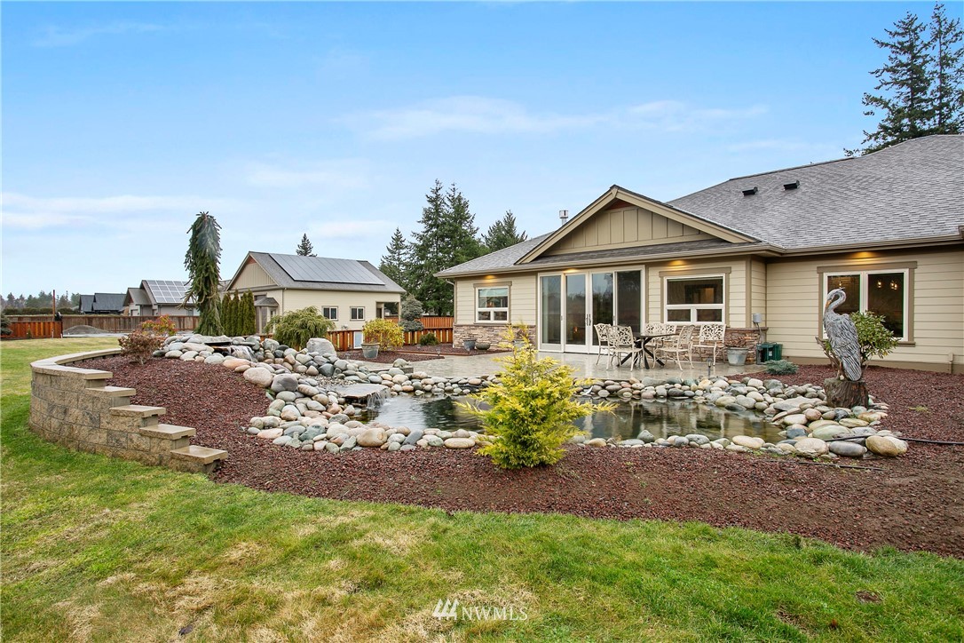 1130 West Axton Road Ferndale, WA 98248 - Photo 18 of 40 a front view of a house with garden