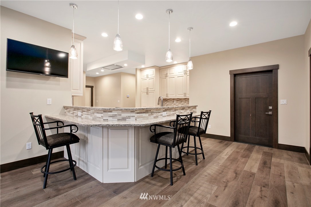 1130 West Axton Road Ferndale, WA 98248 - Photo 19 of 40 a kitchen with a table and chairs in it