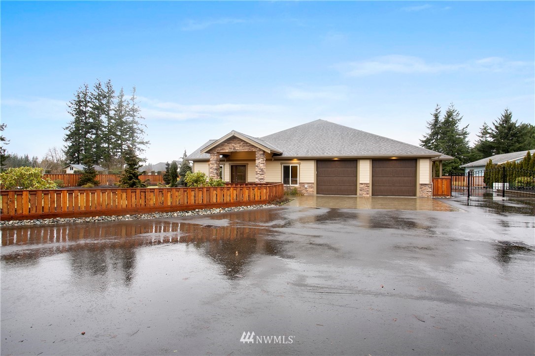 1130 West Axton Road Ferndale, WA 98248 - Photo 2 of 40 a view of a house with yard and lake view