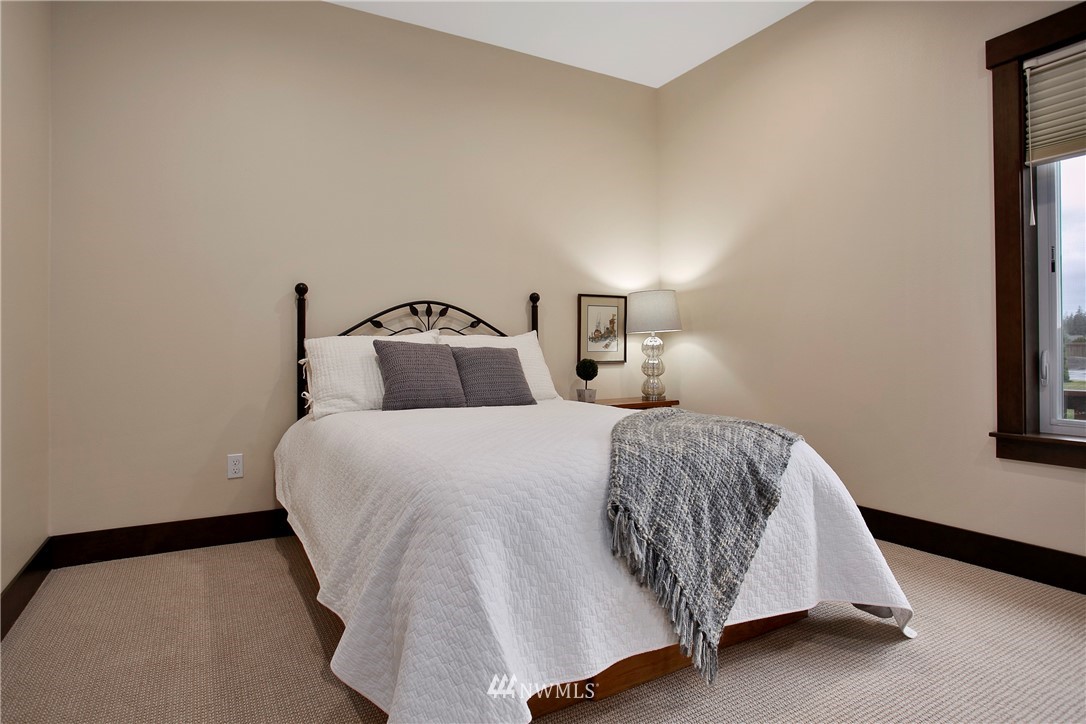 1130 West Axton Road Ferndale, WA 98248 - Photo 24 of 40 a bedroom with a bed and window