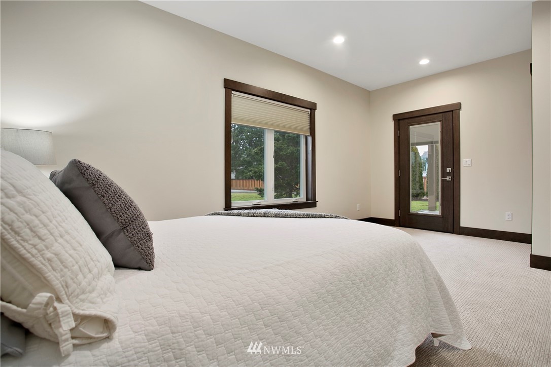 1130 West Axton Road Ferndale, WA 98248 - Photo 25 of 40 a bedroom with a bed and a large window