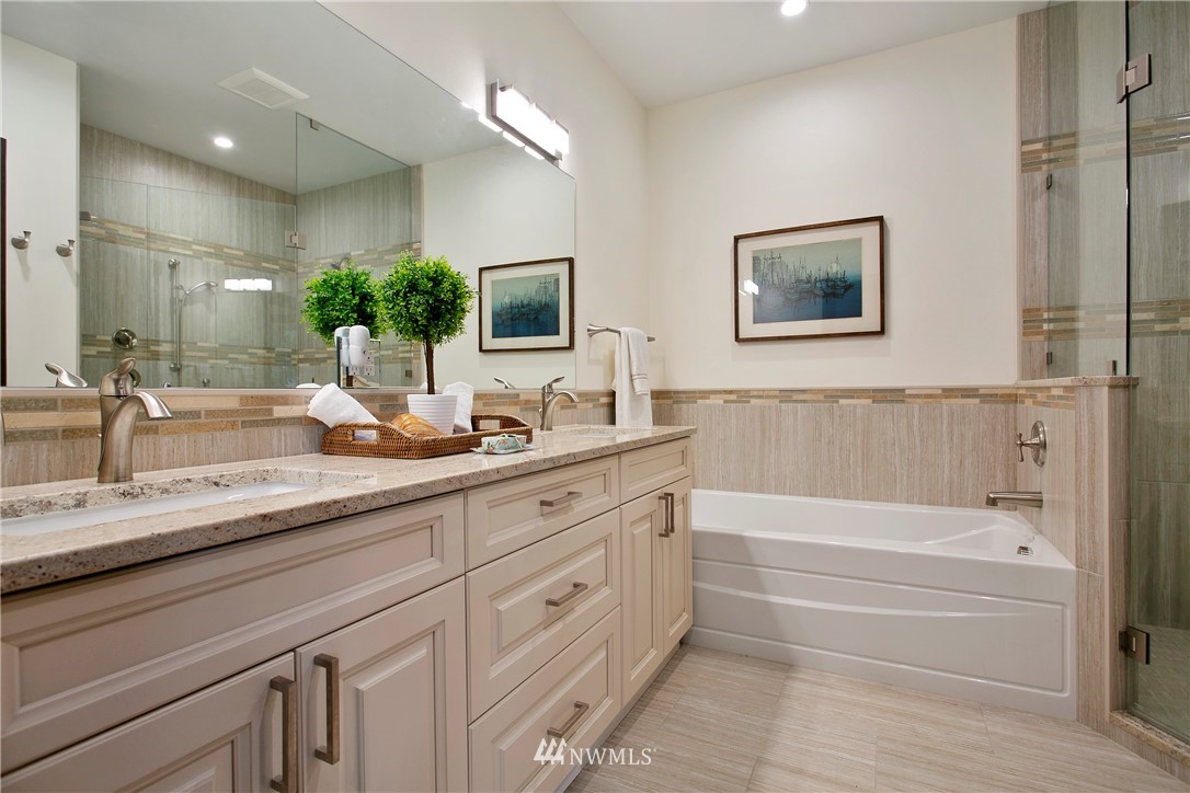 1130 West Axton Road Ferndale, WA 98248 - Photo 29 of 40 a bathroom with a tub a sink and mirror