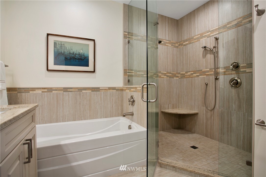 1130 West Axton Road Ferndale, WA 98248 - Photo 30 of 40 a bathroom with a shower and a bath tub