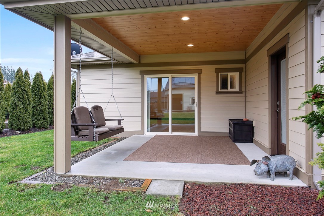 1130 West Axton Road Ferndale, WA 98248 - Photo 31 of 40 a house view with a sitting space and garden space