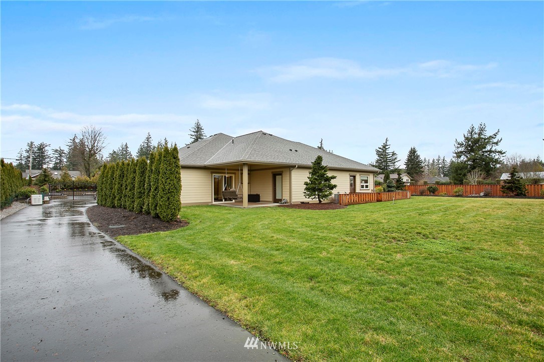 1130 West Axton Road Ferndale, WA 98248 - Photo 32 of 40 a front view of a house with a yard and trees
