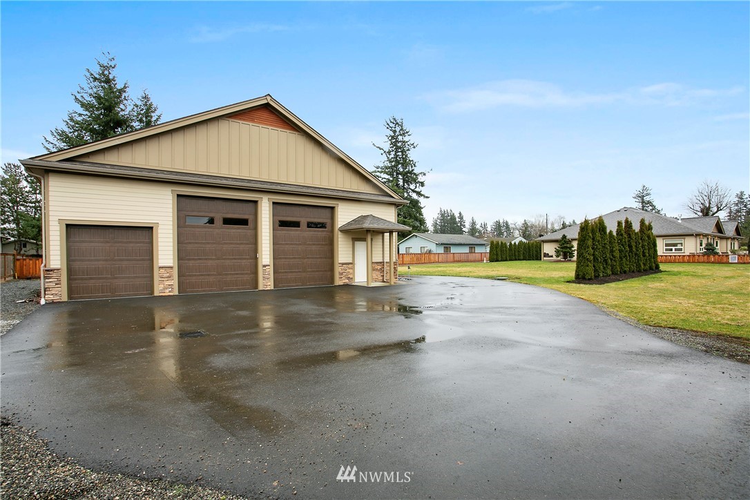1130 West Axton Road Ferndale, WA 98248 - Photo 34 of 40 a view of a house with a yard