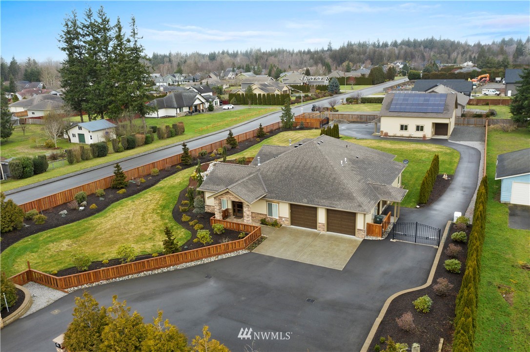 1130 West Axton Road Ferndale, WA 98248 - Photo 40 of 40 an aerial view of a house with a garden and lake view