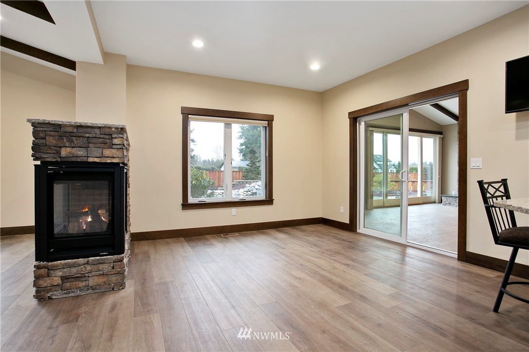 1130 West Axton Road Ferndale, WA 98248 - Photo 8 of 40 a view of an empty room with glass door and a window