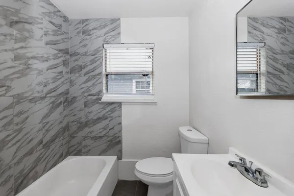 a bathroom with a toilet and a sink