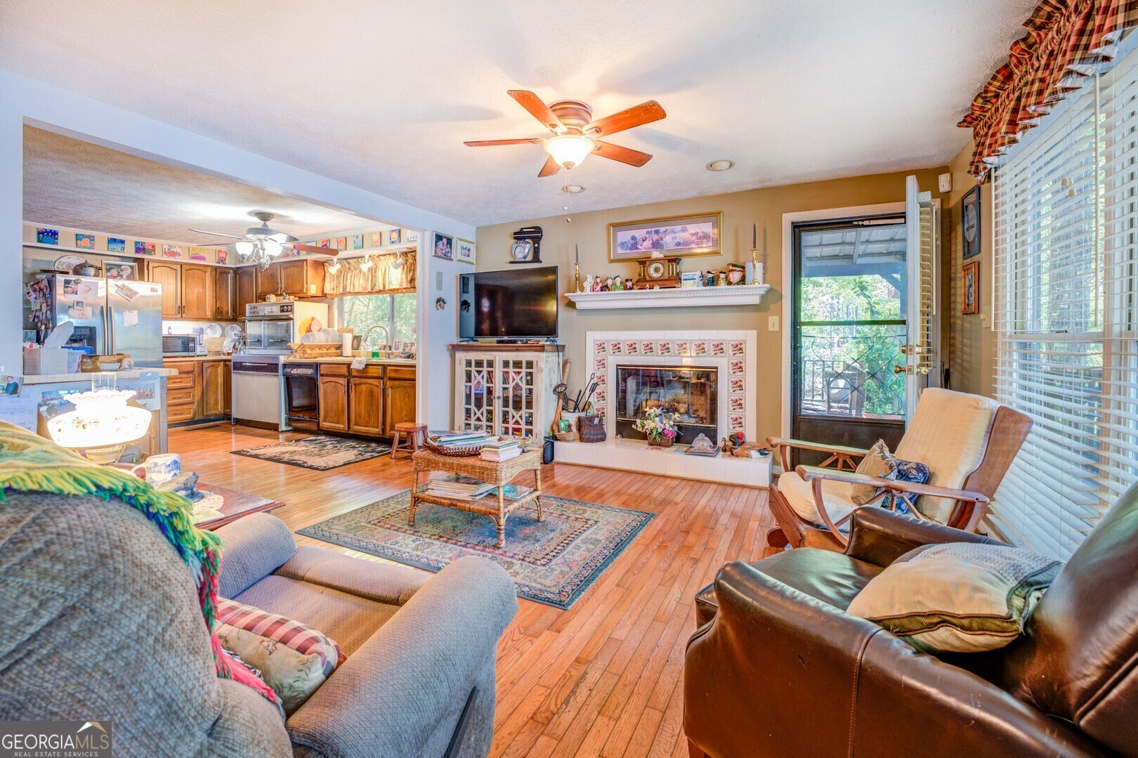 766 Raven Road Monticello, GA 31064 - Photo 29 of 59 a living room with furniture fireplace and a large window